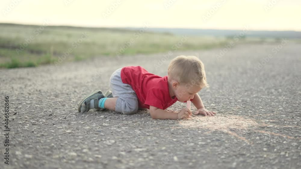 Happy child draw with chalk on asphalt in park. Child play and paint house and sun. Happy family concept Dream of home. Kid dream in park. Concept of kid dream of home. Chalk drawing of sun Happy child draw with chalk on asphalt in park. Child play and paint house and sun. Happy family concept Dream of home. Kid dream in park. Concept of kid dream of home. Chalk drawing of sun