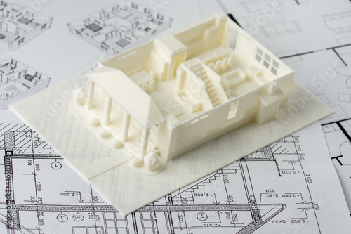 Model of the first floor of a family house printed on a 3D printer with white filament by FDM technology for architectural use. photo