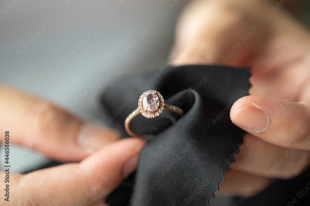 Jeweller cleaning jewelry diamond ring with fabric cloth Stock-Foto | Adobe  Stock