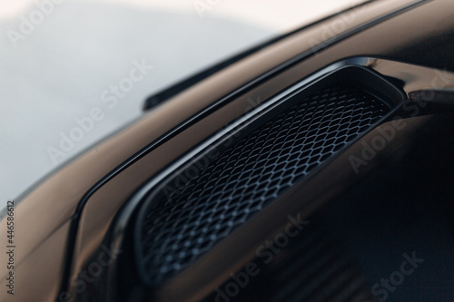Air intake in the carbon hood of sport car photo
