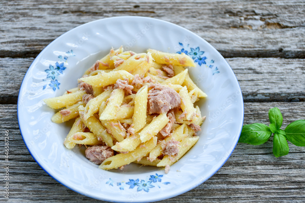  Italian home made   penne pasta  with  tuna  fish, parmesan cheese and black pepper .