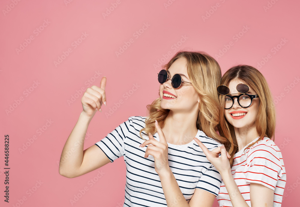 two funny girlfriends with glasses fashionable clothes summer friendship