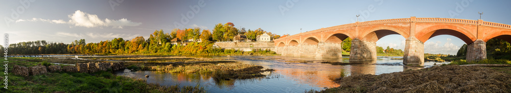 Long brick bridge in sunny autumn day, Kuldiga, Latvia.
