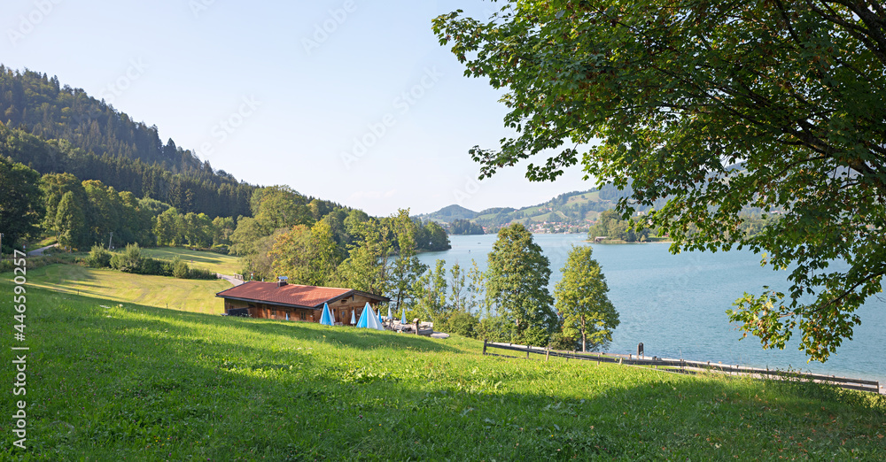 idyllic landscape lake Schliersee, tourist resort and cosy cabin with restaurant. Rixneralm upper bavaria