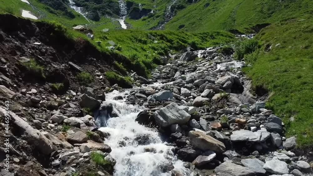 Flying low over a water stream in Austria with lot of rocks. Flying low over a water stream in Austria with lot of rocks.