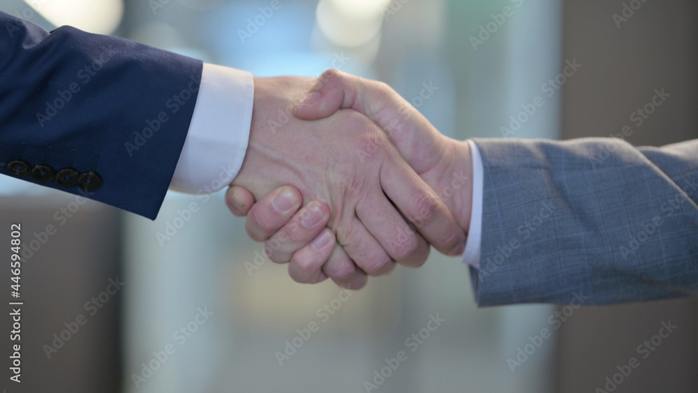 Close up of Businessmen Shaking Hands Close up of Businessmen Shaking Hands