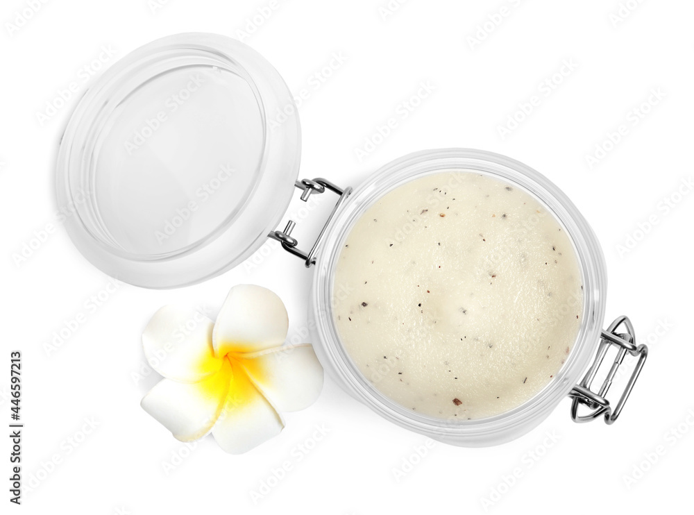 Jar of exfoliating salt scrub and plumeria flower on white background, top view Jar of exfoliating salt scrub and plumeria flower on white background, top view