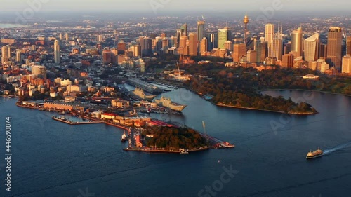 Sydney Waterfront Suburbs With Ferry Boats Sailing In Port Jackson Bay In Sunrise At NSW, Australia. - aerial panning photo