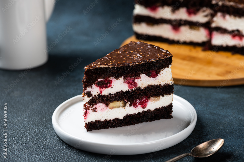 Chocolate cake with raspberry on plate. Slice of cake. Raspberry cake. Wedding dessert. Black forest cake. Delicious dessert. Traditional german dessert Chocolate cake with raspberry on plate. Slice of cake. Raspberry cake. Wedding dessert. Black forest cake. Delicious dessert. Traditional german dessert