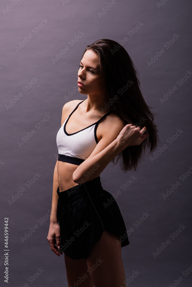 Modern style dancer posing on studio background Modern style dancer posing on studio background