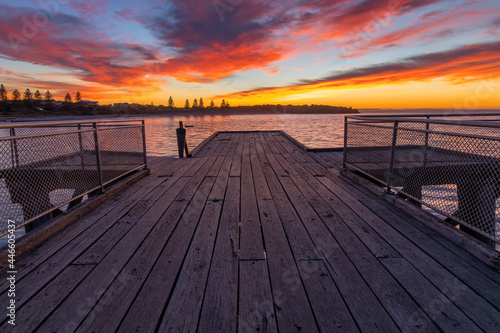 Fototapeta Naklejka Na Ścianę i Meble -  Sunrise over the iconic Port Elliot jetty located on the Fleurieu Peninsula South Australia taken on May 31st 2021