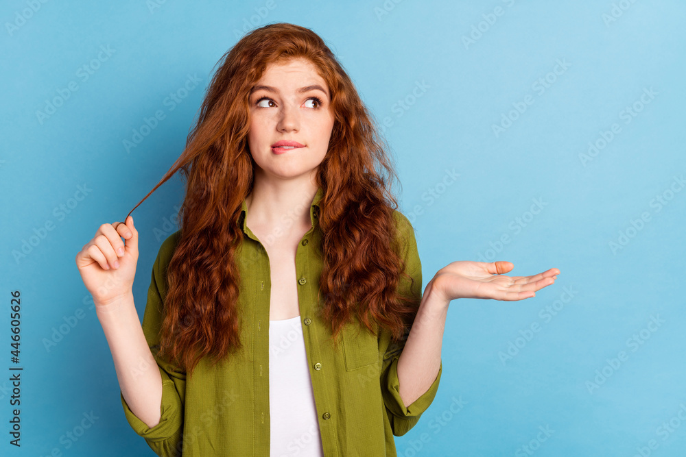 Portrait of attractive puzzled long-haired girl overthinking biting lip copy space clue isolated over pastel blue color background Portrait of attractive puzzled long-haired girl overthinking biting lip copy space clue isolated over pastel blue color background