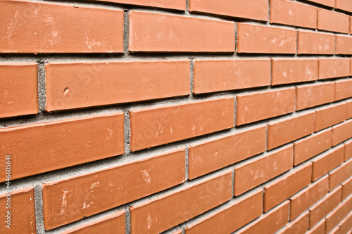 Red brick wall in perspective. Masonry brickwork background.