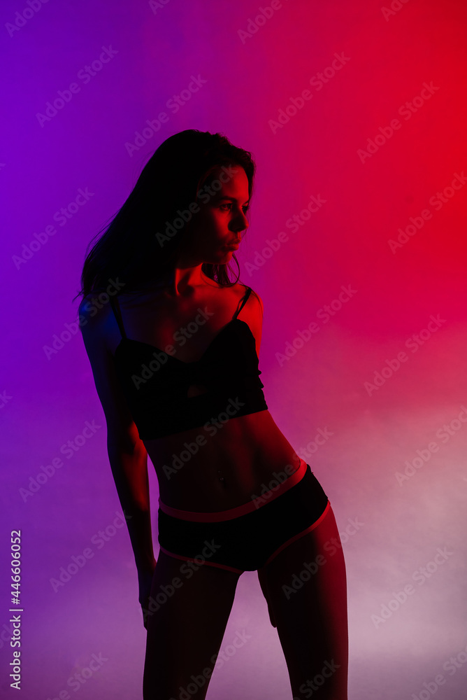 Modern style dancer posing on studio background Modern style dancer posing on studio background