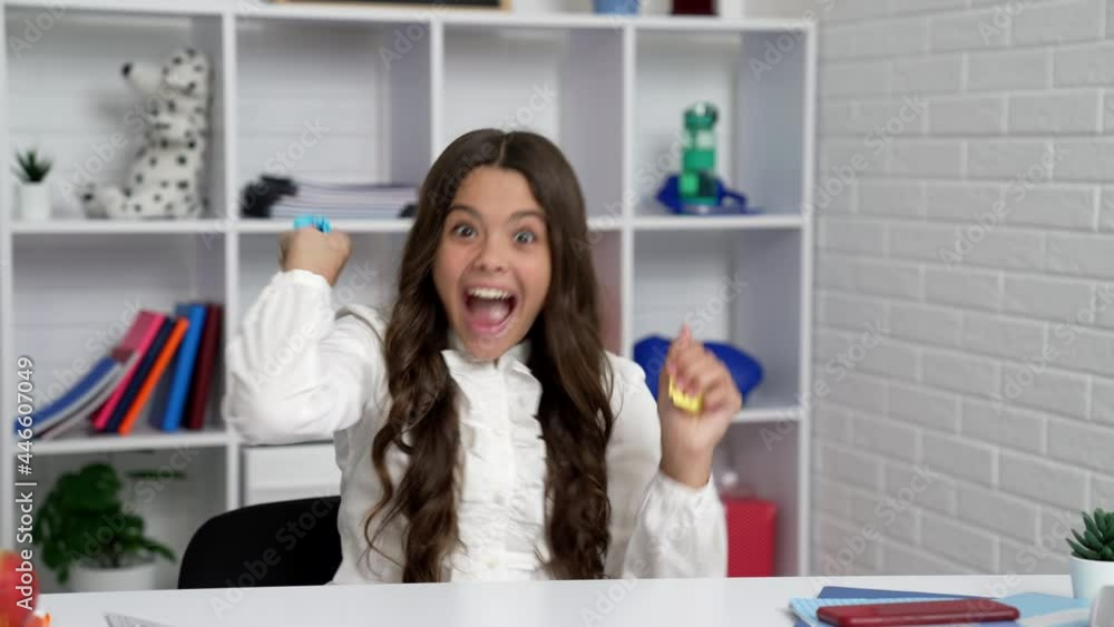 funny child in school uniform playing throwing squeezed paper in classroom, school break funny child in school uniform playing throwing squeezed paper in classroom, school break