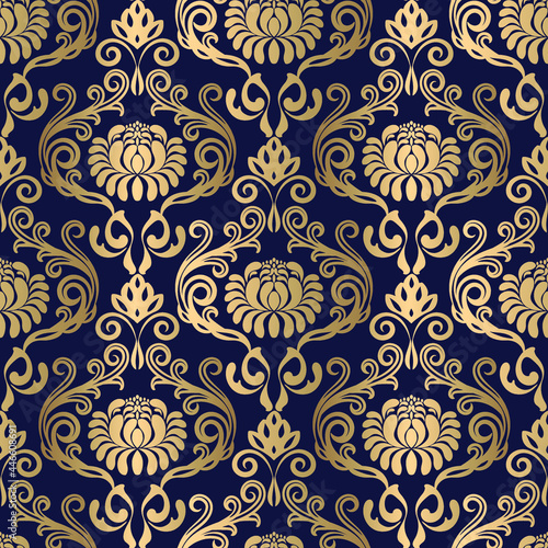 Golden seamless damask pattern on blue background in vector 