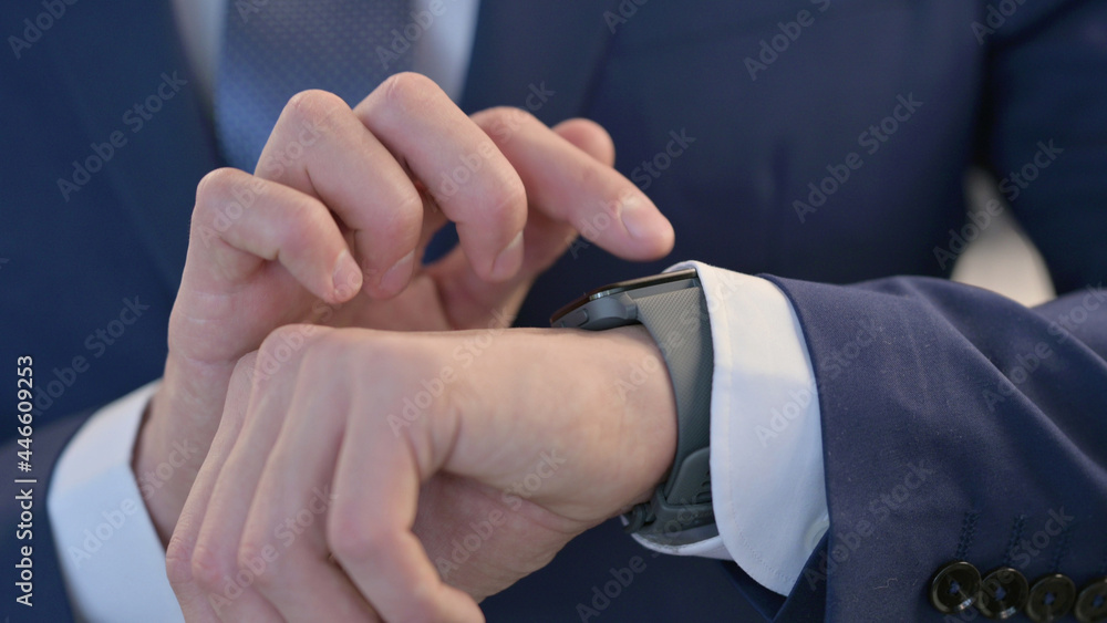 Close up of Hands of Businessman using Smartwatch