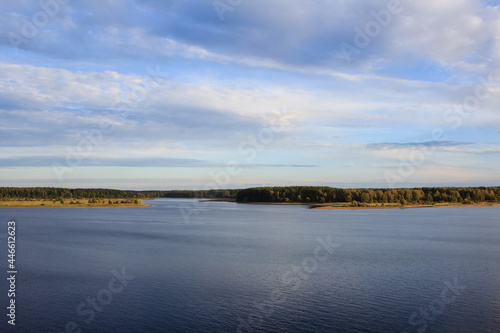 landscape view of the river Volga valley with fields and forest under the cloudy sky
