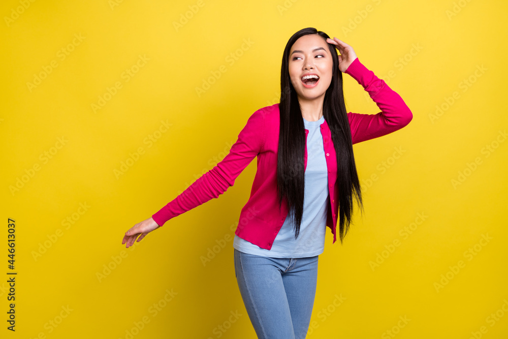Photo of attractive young nice woman look empty space good mood dance isolated on shine yellow color background Photo of attractive young nice woman look empty space good mood dance isolated on shine yellow color background