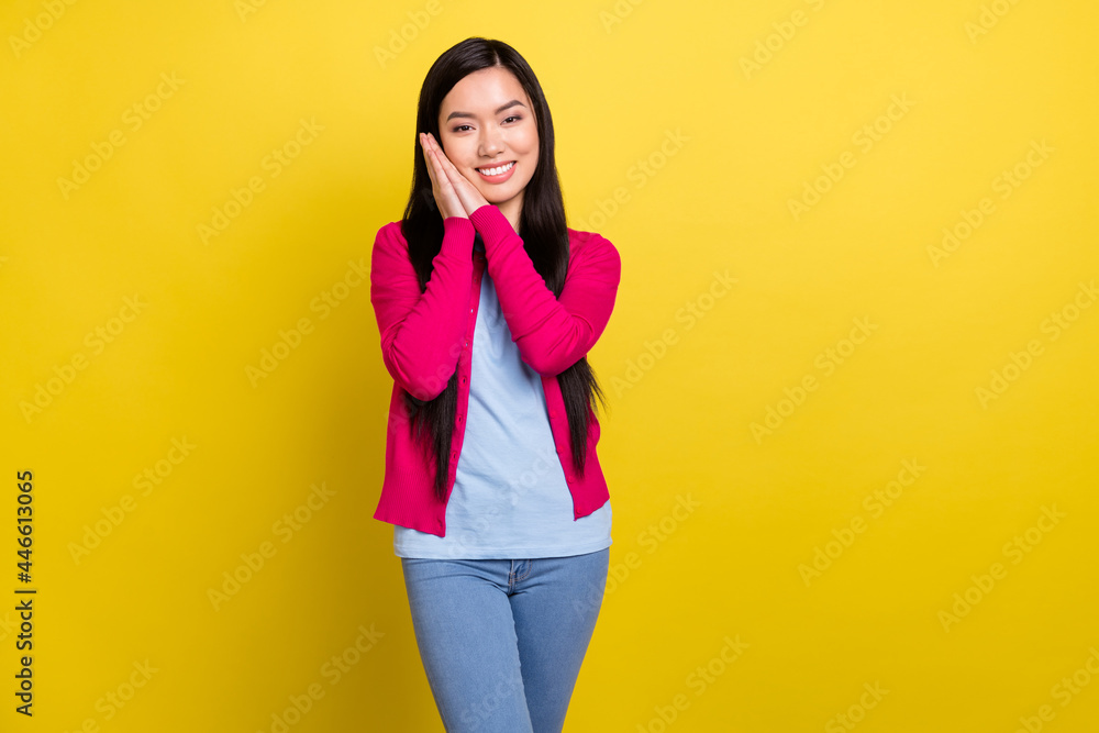 Photo of attractive young pretty woman hold hands face sleep isolated on shine yellow color background Photo of attractive young pretty woman hold hands face sleep isolated on shine yellow color background