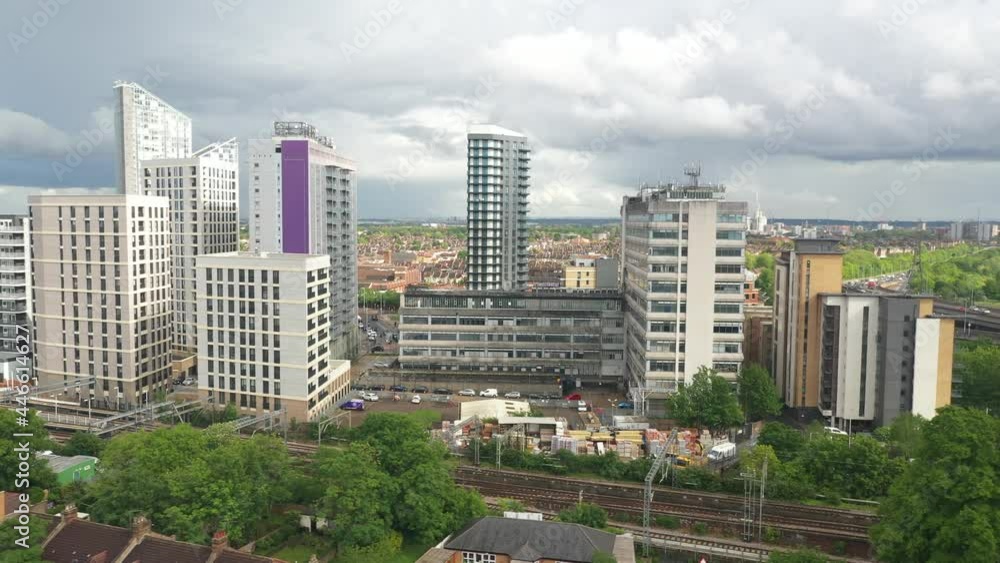 group of tall buildings behind railway tracks. Large town landscape group of tall buildings behind railway tracks. Large town landscape