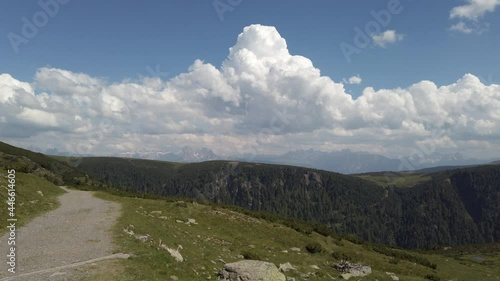 4k video footage with slight pan right of Sarntal landscape with Dolomites massif in the background photo