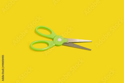 top view of scissors isolated on a yellow background
