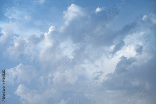 Summer blue sky at sunset with clouds near the coast. Vector clouds texture
