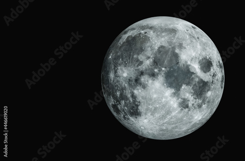 Detailed full moon on a dark night. Beautiful texture of the moon
