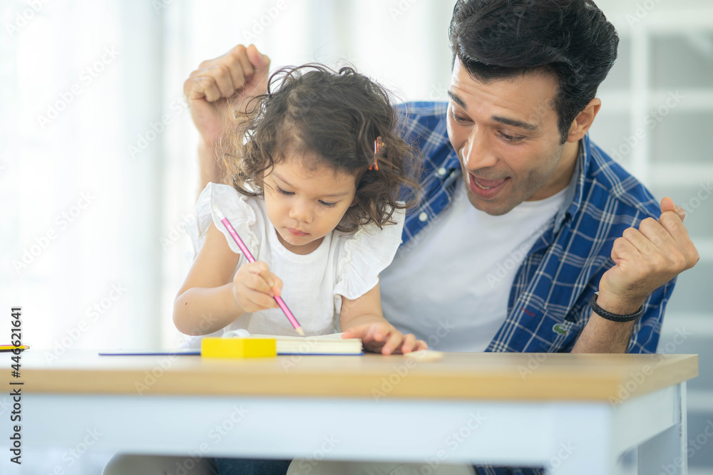 Happy family: Father teaching his cute little daughters' study. Family creativity and education at child's room, home schooling concept. Happy family: Father teaching his cute little daughters' study. Family creativity and education at child's room, home schooling concept.