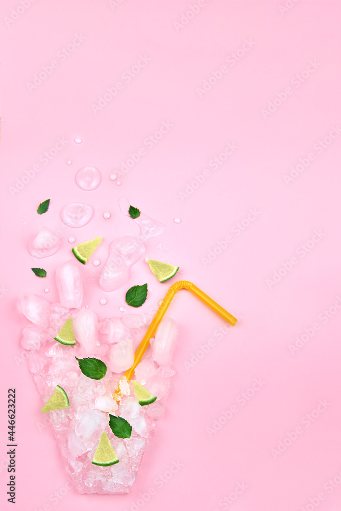 Ice, mint, lime in the form of a glass on a pink background, copy space. Ice, mint, lime in the form of a glass on a pink background, copy space.