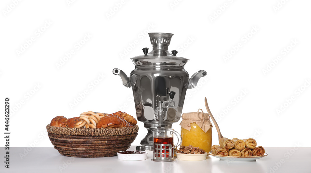 Fototapeta premium Traditional Russian samovar with treats isolated on white
