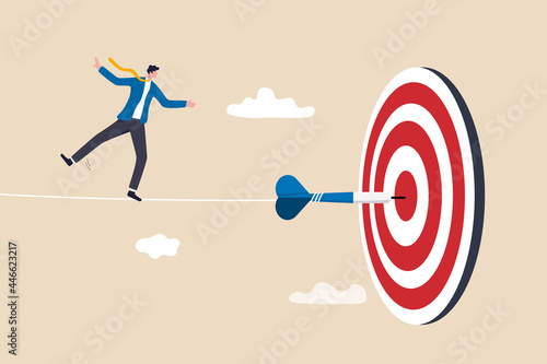 Challenge to overcome difficulty and achieve business target, risk management or strategy and skill to win and success concept, skillful businessman acrobat walk on rope to reach bullseye dart target.