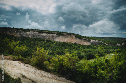 Cave city Kachi Kalon in Bakhchisarai in the Republic of Crimea, Russia. Beautiful Crimean landscape: mountains, trees, rocks. photo