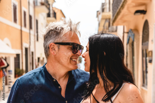 Photography Beautiful couple with cute woman and trendy middle aged man looking into each ot
