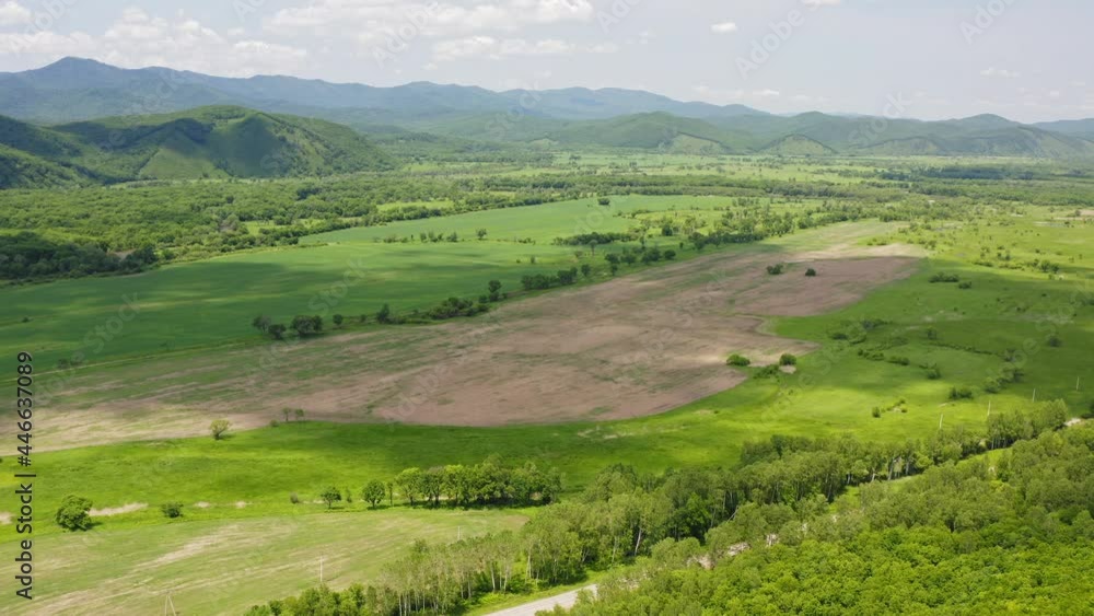 Drone view of a landscape with green forests and fields Drone view of a landscape with green forests and fields