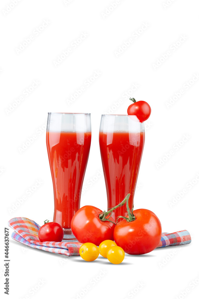 Two glasses with tomato juice and a small tomato on a bright background. Two glasses with tomato juice and a small tomato on a bright background.