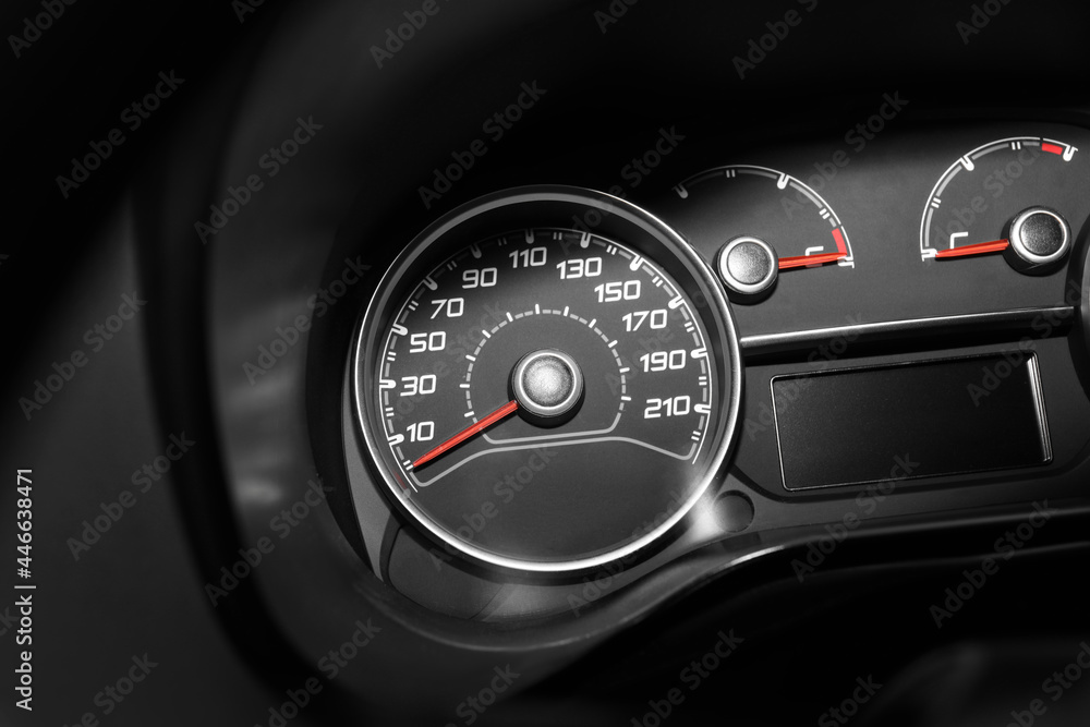 Naklejka premium Modern speedometer with red arrow on dashboard of car