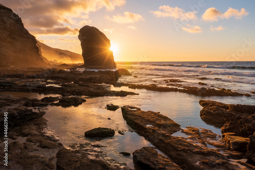 Golden sunset over the giant monolith of Roque Del Moro, Cofete beach, Jandia Nature Park, Fuerteventura, Canary Islands, Spain photo
