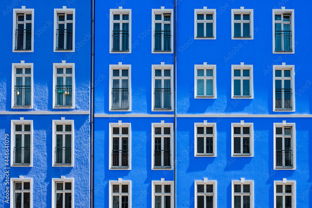 apartment building with blue facade,house exterior