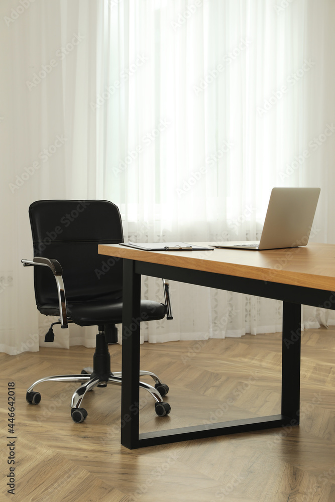 Director's office with large wooden table and comfortable armchair. Interior design Director's office with large wooden table and comfortable armchair. Interior design