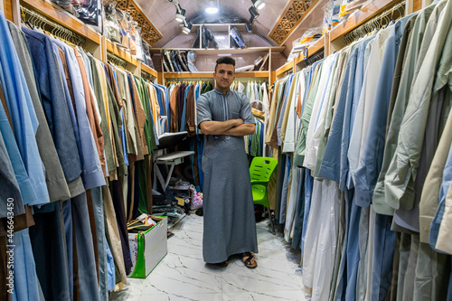 Man in his clothes shop, Ezekiel's Tomb, Al Kifl, Kerbala, Iraq photo