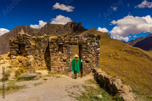 Woman exploring Inti Punku (Sun Gate), Cusco, Peru photo