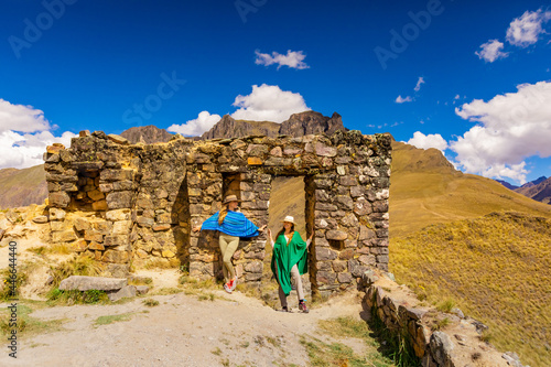 Woman exploring Inti Punku (Sun Gate), Cusco, Peru photo