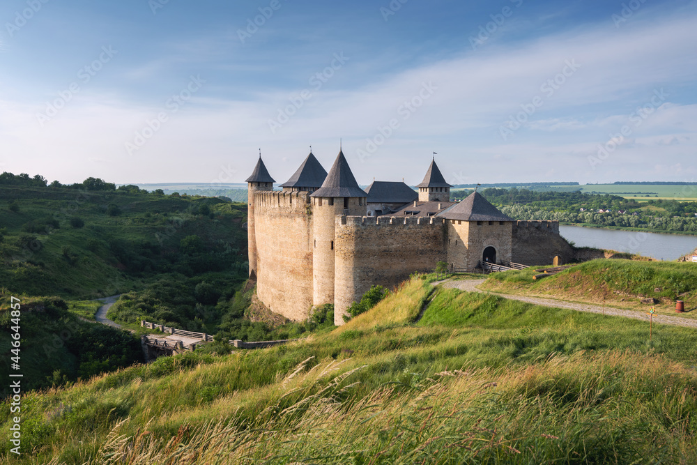 Ancient Khotyn Fortress on the bank of Dniester River in Ukraine. Entrance view of medieval castle at summertime. Ukraine landmarks and monuments