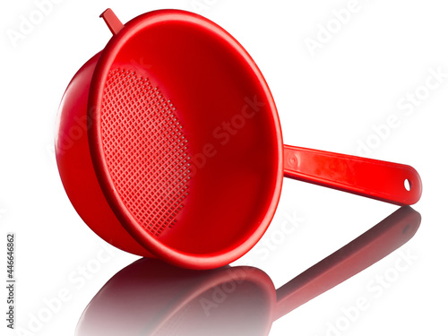 red plastic colander isolated on a white background