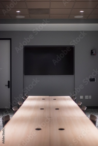 office conference room with black and brown chairs and tables
