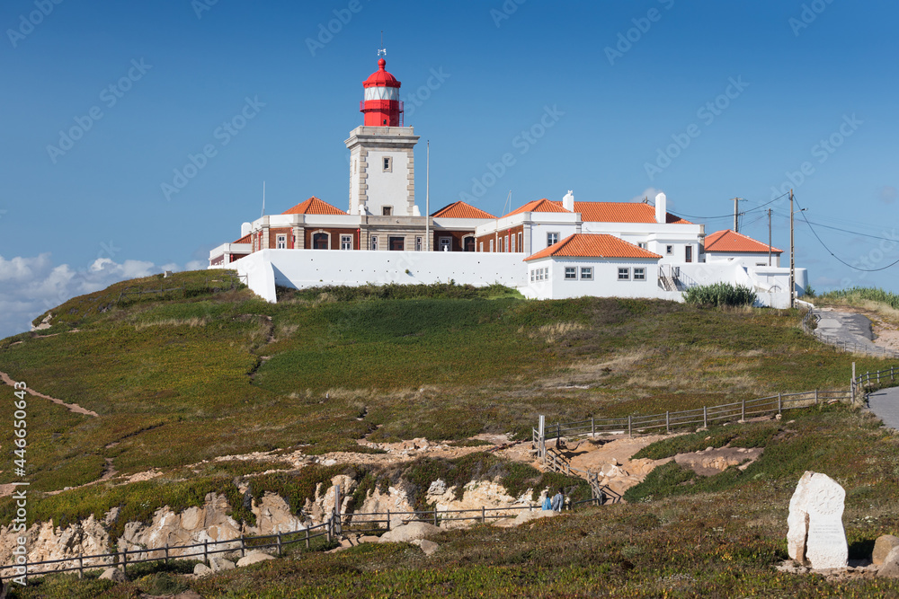 Portugal. Cabo da Roca and the lighthouse over Atlantic Ocean, the most westerly point of the European mainland. Aerial view. Concept for travel in Portugal and most beautiful places in Portugal. Portugal. Cabo da Roca and the lighthouse over Atlantic Ocean, the most westerly point of the European mainland. Aerial view. Concept for travel in Portugal and most beautiful places in Portugal.