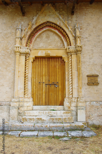 Rocca Pia -  AQ  - Church of the Madonna del Casale.   It has a simple facade  a late Gothic portal  a straight architrave and a series of friezes and decorations.