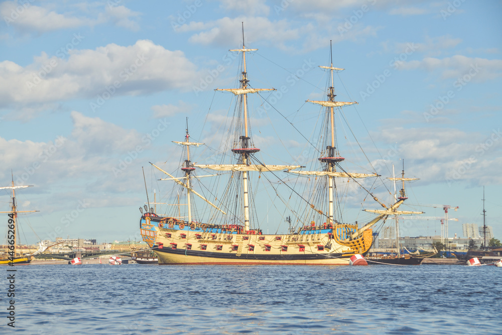 the water an old sailing frigate with guns